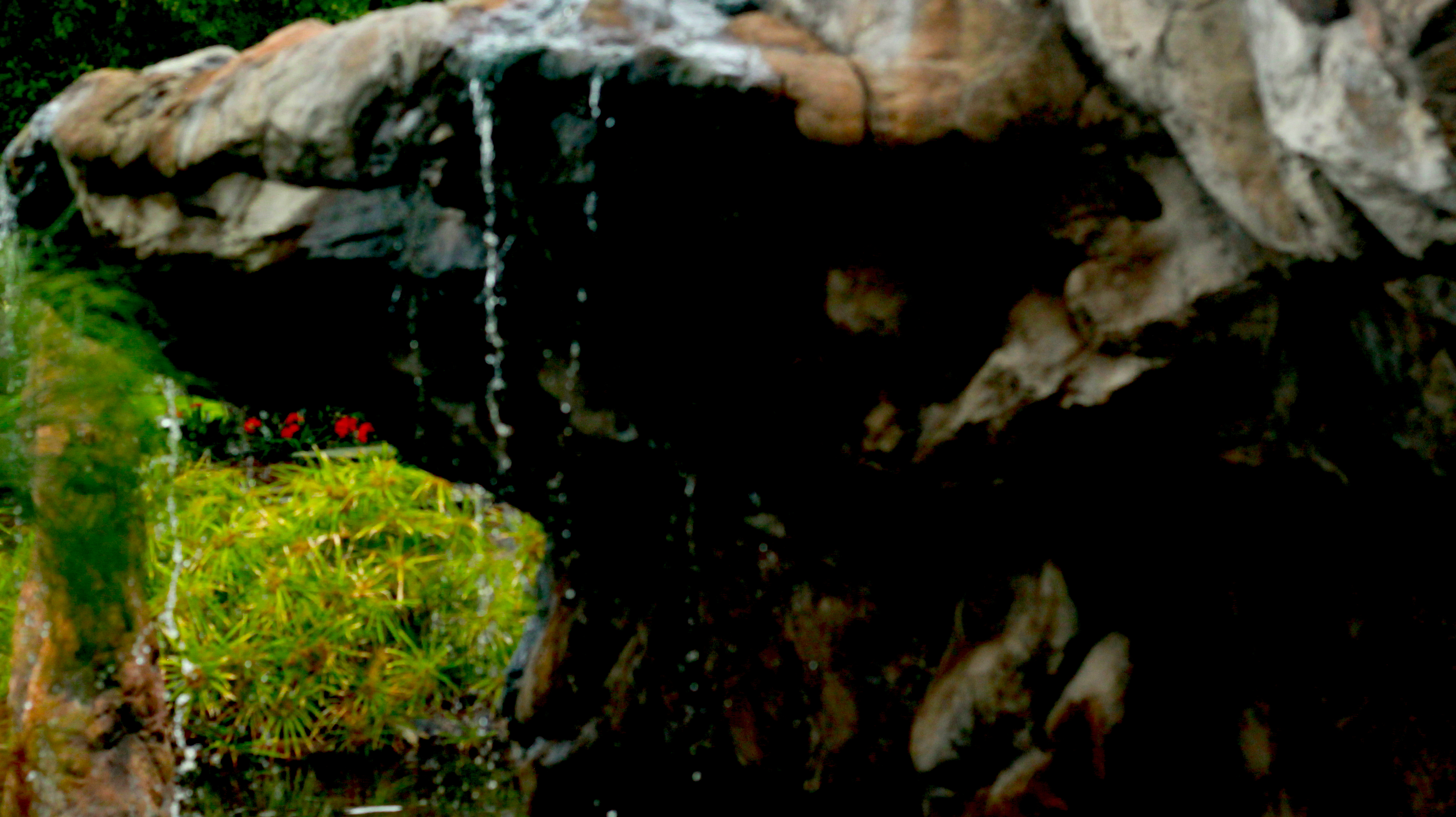 Water dripping down from a large rock